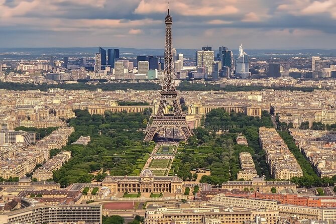 Paris from above, with the Eiffel Tower and the towers of La D&eacute;fense beyond